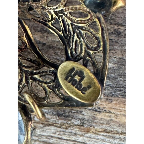 Vintage Hobe Gold-Tone Filigree Floral Brooch With Dangling Clear Glass Accents - Picture 6 of 6